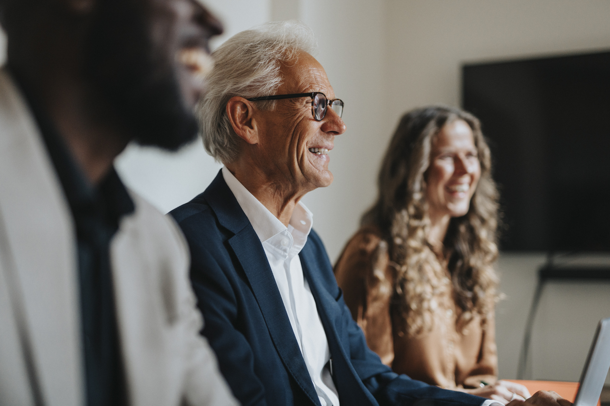PE operating partners in a boardroom discussion